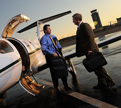 business traveler boarding jet